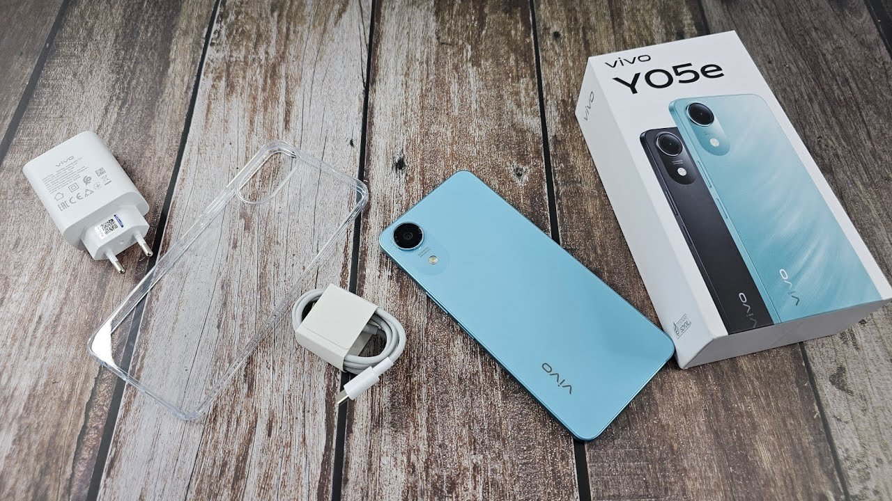 Vivo Y05e phone with box, charger, cable, and clear case.